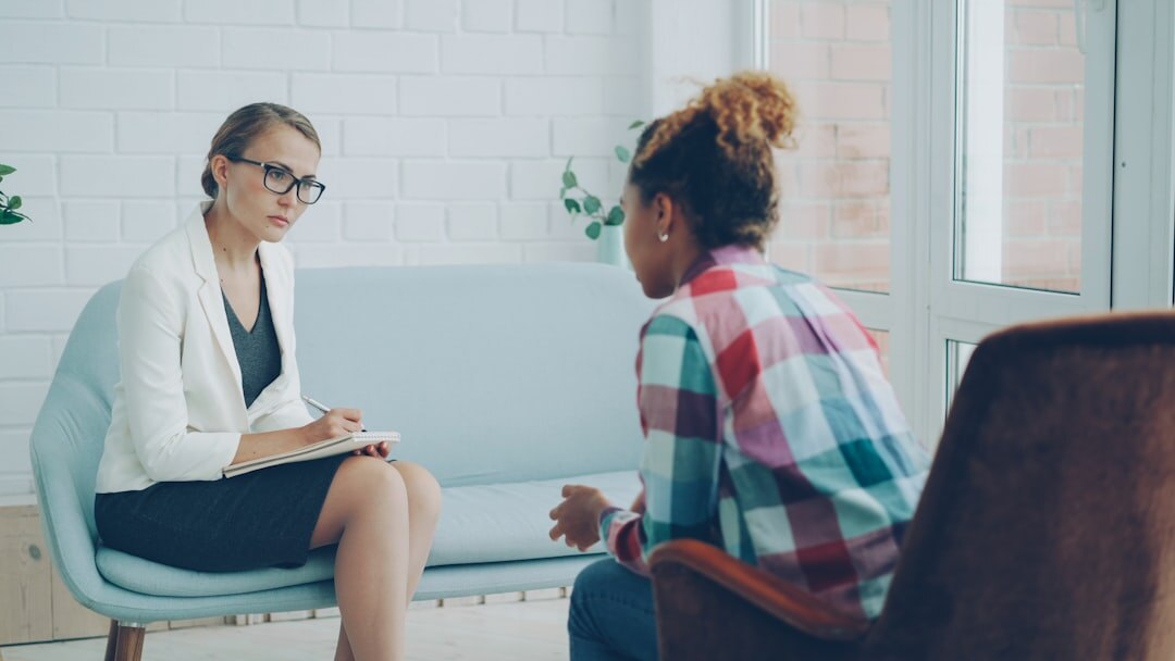 Business mediator facilitating a discussion between two colleagues
